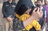 the mother of azan kisses her son after his safe recovery from abductors capturing a moment of relief and affection photo express