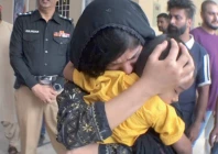 the mother of azan kisses her son after his safe recovery from abductors capturing a moment of relief and affection photo express