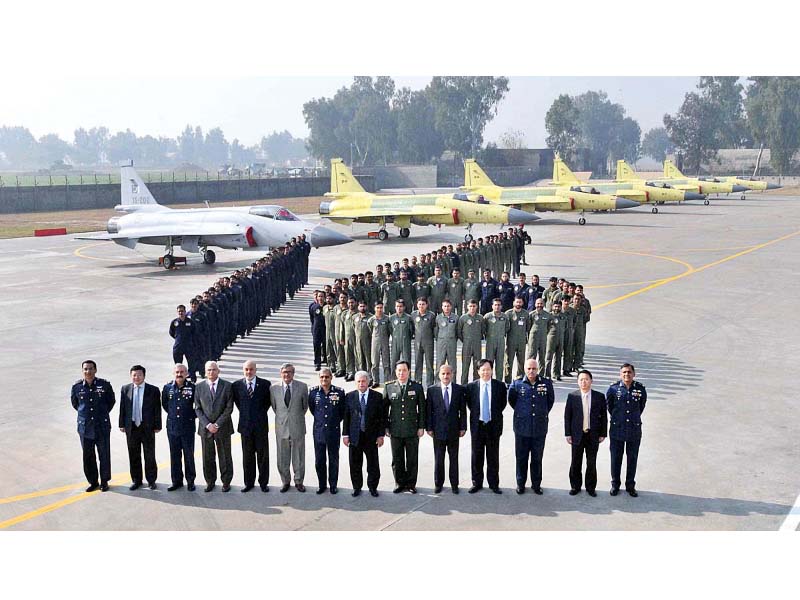minister for defence production rana tanveer and chief of air staff air marshal sohail aman along with other senior officials pose for a group photograph at pakistan aeronautical complex photo app