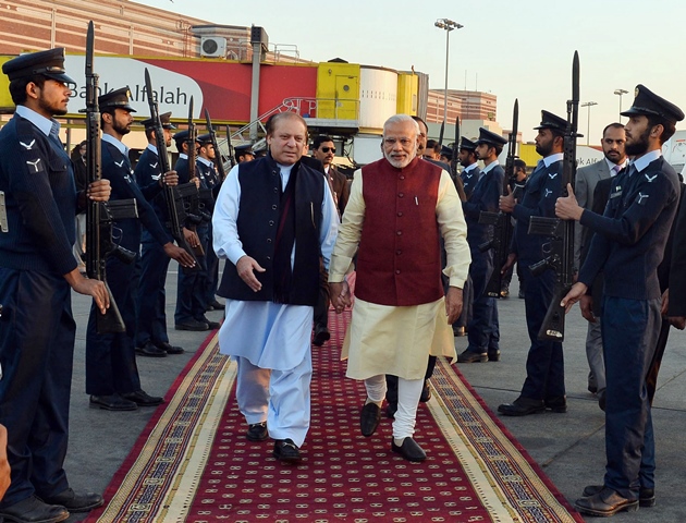 indian prime minister narendra modi and prime minister nawaz sharif walk through a guard of honour in lahore photo afp