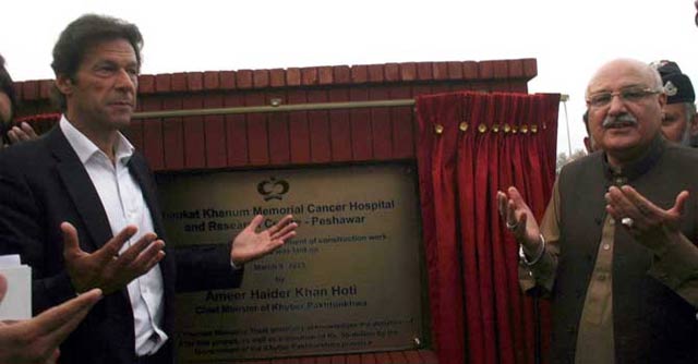 imran khan amp k p information minister mian iftikhar hussain offer parayer after laying foundation stone of the cancer hospital in peshawar on march 9 photo inp