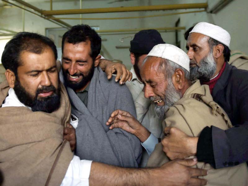 relatives of the mardan bombing victims mourn at a hospital photo afp