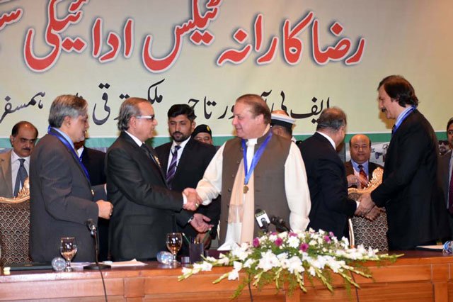 prime minister nawaz sharif shakes hands with a representative of traders after his arrival at the launching ceremony of voluntary tax compliance scheme in islamabad on january 01 2016 photo pid