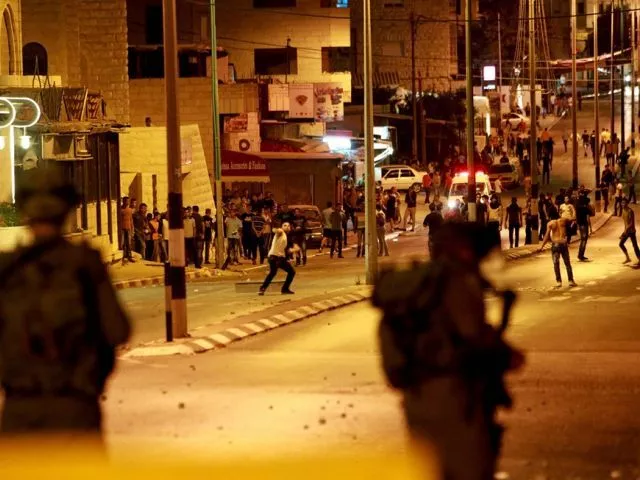 in this file photo palestinian protesters throw stones towards an israeli military observation tower at a section of the separation barrier to the main entrance of the west bank city of bethlehem photo afp in this file photo palestinian protesters throw stones towards an israeli military observation tower at a section of the separation barrier to the main entrance of the west bank city of bethlehem photo afp