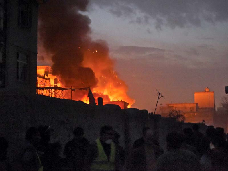 flames and smoke rise at the site of the suicide attack photo afp