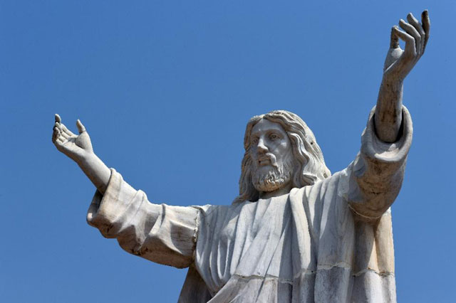 the nine metre tall statue of jesus christ carved from white marble thought to be the biggest of its kind in africa is unveiled in abajah southeastern nigeria on january 1 2016 photo afp