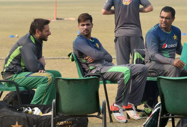 pakistani cricket coach waqar younis r chats with cricketers shahid afridi l and muhammad amir during a team practice session at a camp ahead of the new zealand tour in lahore on january 2 2016 pakistani cricket coach waqar younis r chats with cricketers shahid afridi l and muhammad amir during a team practice session at a camp ahead of the new zealand tour in lahore on january 2 2016