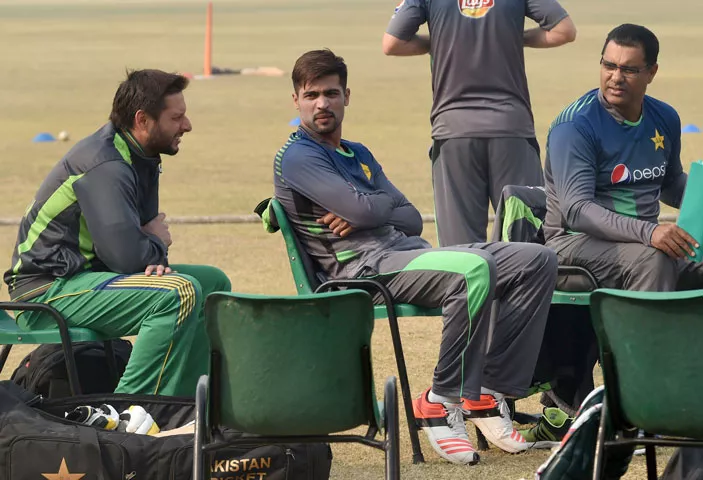 pakistani cricket coach waqar younis r chats with cricketers shahid afridi l and muhammad amir during a team practice session at a camp ahead of the new zealand tour in lahore on january 2 2016 pakistani cricket coach waqar younis r chats with cricketers shahid afridi l and muhammad amir during a team practice session at a camp ahead of the new zealand tour in lahore on january 2 2016