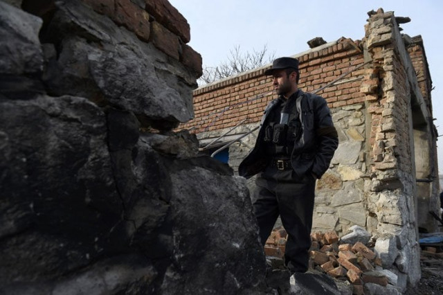 an afghan security official inspects the wreckage of an entrance gate the day after a suicide car bomb attack at a french restaurant le jardin in kabul on january 2 2016 photo afp an afghan security official inspects the wreckage of an entrance gate the day after a suicide car bomb attack at a french restaurant le jardin in kabul on january 2 2016 photo afp