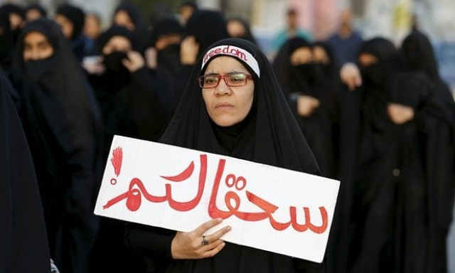 protester holds a banner saying to hell with you as she takes part in a protest against the execution of saudi shia cleric nimr al nimr by saudi authorities in the village of sanabis photo reuters protester holds a banner saying to hell with you as she takes part in a protest against the execution of saudi shia cleric nimr al nimr by saudi authorities in the village of sanabis photo reuters