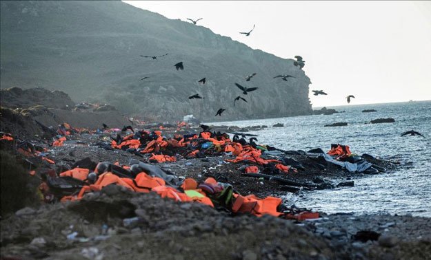 life vests left by migrants and refugees after arriving on the shores of the greek island of lesbos after crossing the aegean sea from turkey are seen on november 12 2015 photo afp