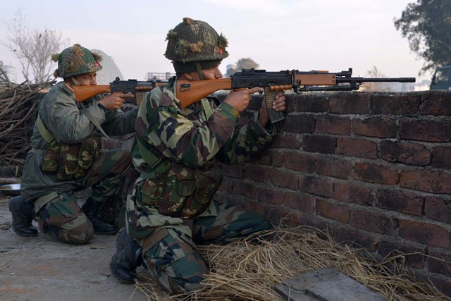 indian army soldiers take up position on the perimeter of an airforce base in pathankot on january 3 2016 photo afp