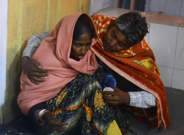 an injured indian woman is comforted by her husband as she waits for treatment at siliguri hospital following an earthquake in siliguri on january 4 2016 photo afp an injured indian woman is comforted by her husband as she waits for treatment at siliguri hospital following an earthquake in siliguri on january 4 2016 photo afp