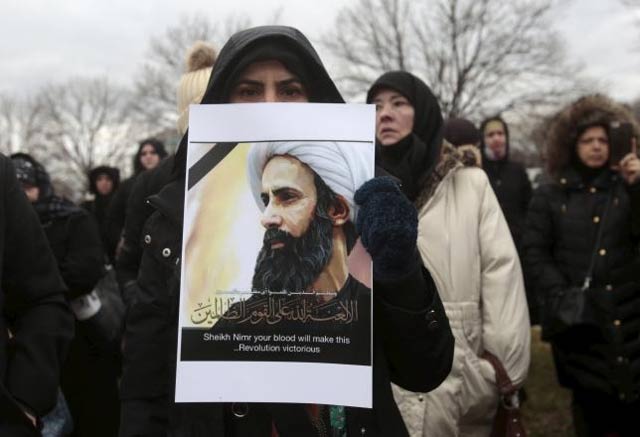 a muslim american protests against the execution of shia muslim cleric nimr al nimr in saudi arabia during a rally in dearborn michigan january 3 2016 photo reuters