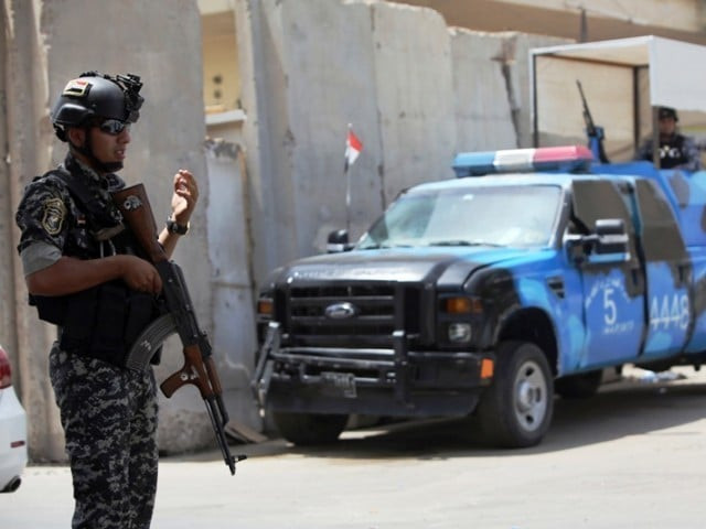 iraqi policeman at a checkpoint in the capital baghdad on june 12 2014 iraqi policeman at a checkpoint in the capital baghdad on june 12 2014