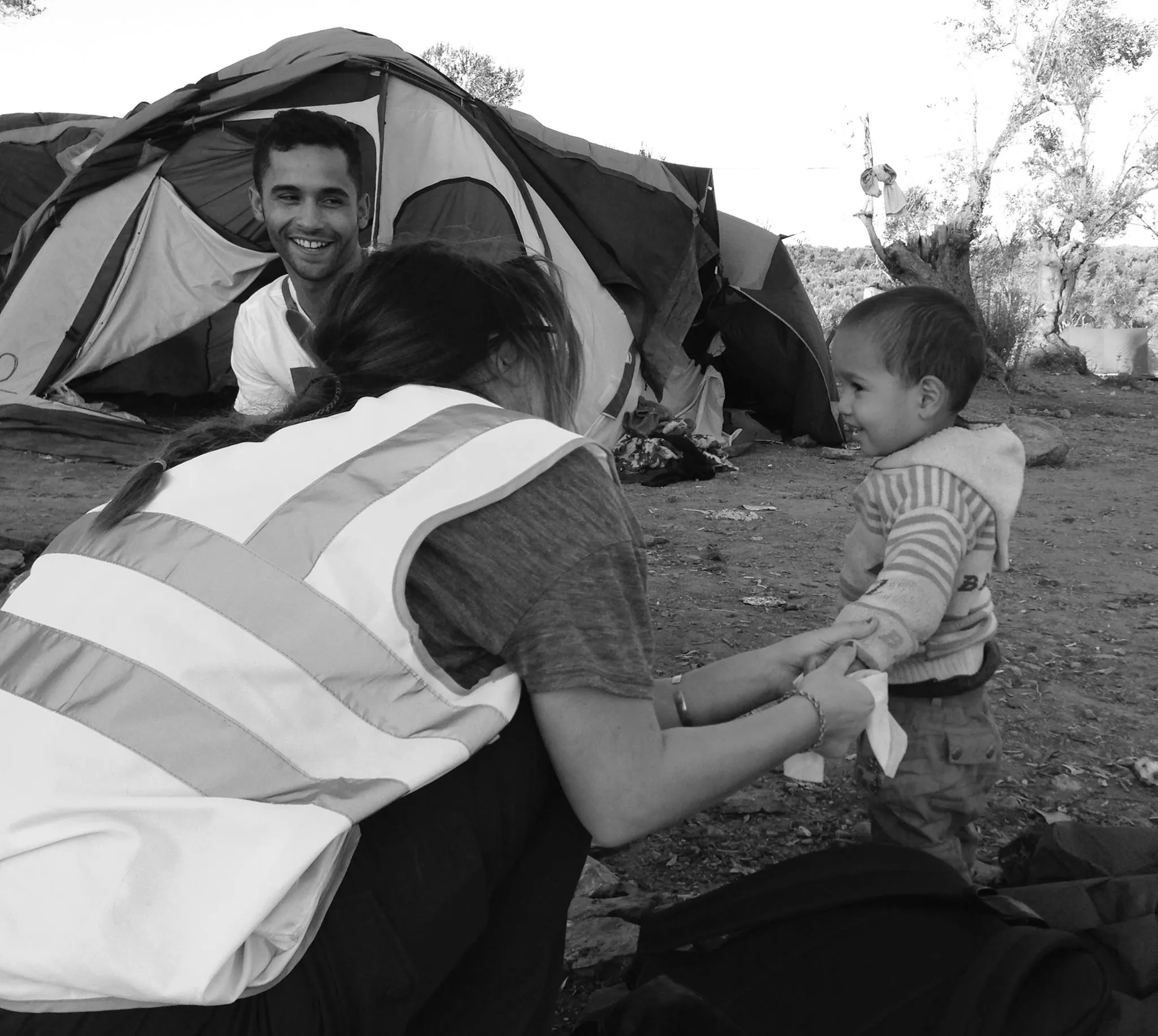 the photograph captures ellyse and lucas at the camp with one of the many refugees in lesbos photo kate hughes the photograph captures ellyse and lucas at the camp with one of the many refugees in lesbos photo kate hughes