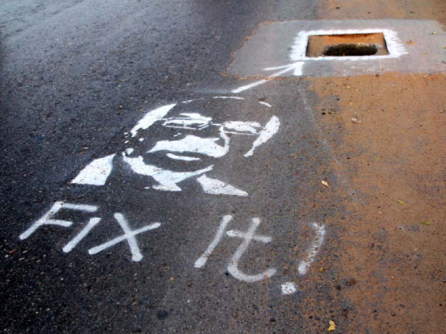 alamgir khan has stenciled the cm s face near locations begging for government action he painted the cm s face near a manhole outside karachi university above photo aysha saleem express alamgir khan has stenciled the cm s face near locations begging for government action he painted the cm s face near a manhole outside karachi university above photo aysha saleem express