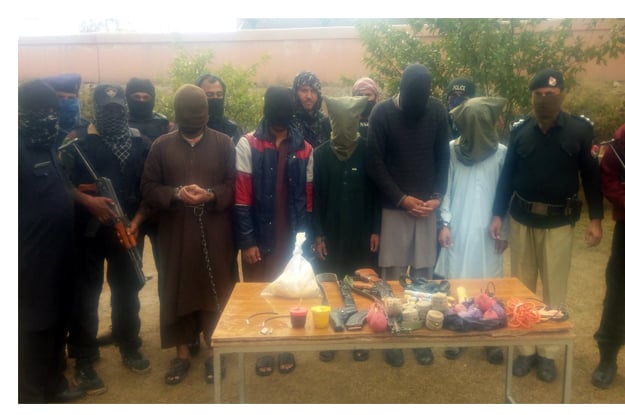 special police unit personnel presenting the arrested militants before the media photo inp