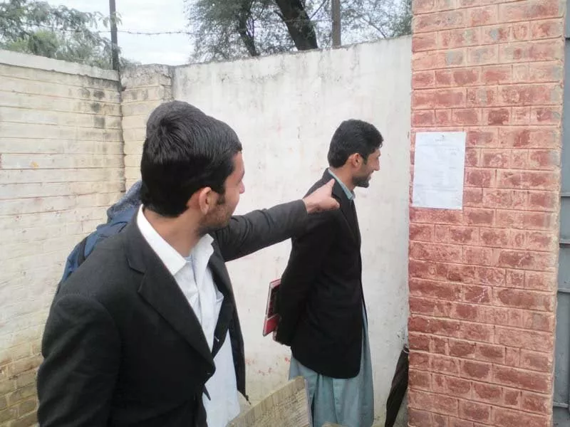 men read pamphlet issued by the political administration of mohmand agency photos express men read pamphlet issued by the political administration of mohmand agency photos express