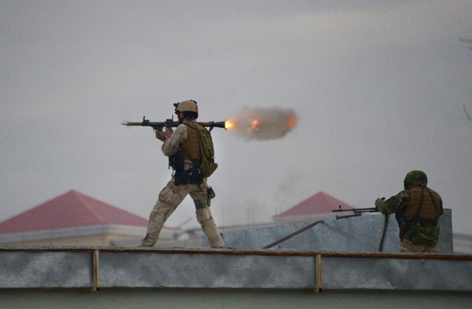 an afghan quick reaction force soldier fires a rocket propelled grenade launcher during an operation near the indian consulate in mazar i sharif on january 4 2016 photo afp