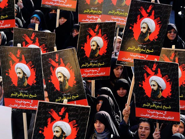 iranian women gather during a demonstration against the execution of prominent shiite muslim cleric nimr al nimr portrait by saudi authorities at imam hossein square in the capital tehran on january 4 2016 photo afp