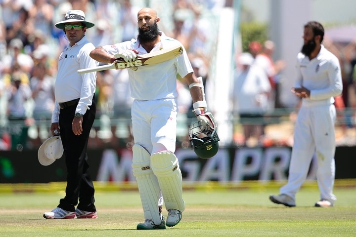 hashim amla raises his bat as he celebrates scoring a doube century 200 runs during day 4 of the second test match between england and south africa at newlands stadium on january 5 2016 in cape town south africa photo afp