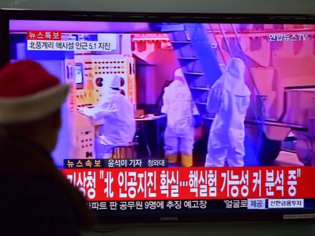 a man watches a news report at a railroad station in seoul on january 6 2016 after seismologists detected a 5 1 magnitude tremor next to north korea 039 s main atomic test site in the northeast of the country photo afp