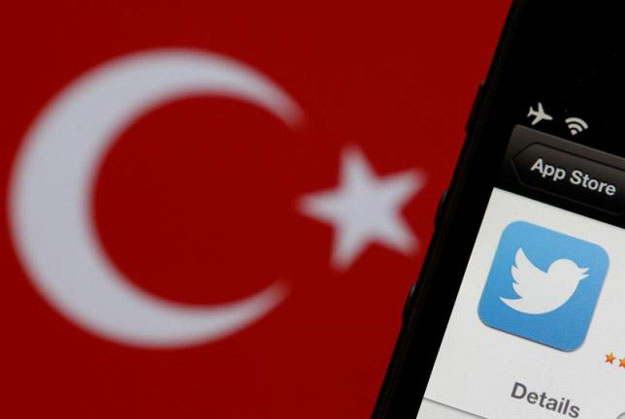 a twitter logo on an iphone display is pictured next to a turkish flag in this photo illustration taken in istanbul march 21 2014 photo reuters