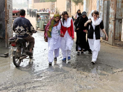 students tread maze of puddles to enter college students tread maze of puddles to enter college