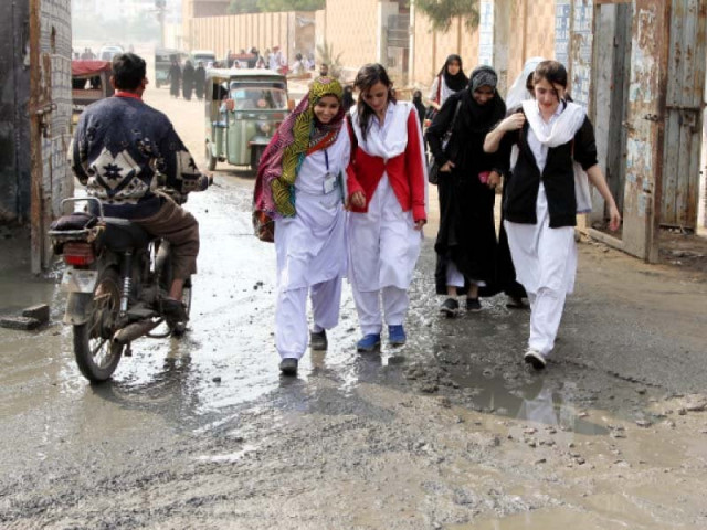 the muddy water inundating the entrance of all pakistan women association government college for women karimabad has made entering the college a difficult task for the students and the faculty photo aysha saleem express the muddy water inundating the entrance of all pakistan women association government college for women karimabad has made entering the college a difficult task for the students and the faculty photo aysha saleem express