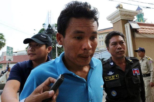 a cambodian suspect is escorted by police officials at phnom penh municipal court on january 8 2016 photo afp a cambodian suspect is escorted by police officials at phnom penh municipal court on january 8 2016 photo afp