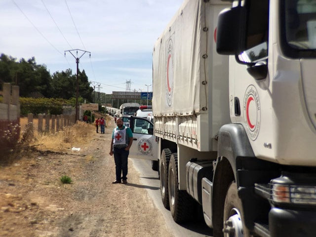 a file handout picture released by the international committee of the red cross icrc shows a relief convoy carrying medical items having a stopover 10 km from syrian cities of zabadani and madaya some 50 km northwest of damascus on october 18 2015 photo afp a file handout picture released by the international committee of the red cross icrc shows a relief convoy carrying medical items having a stopover 10 km from syrian cities of zabadani and madaya some 50 km northwest of damascus on october 18 2015 photo afp