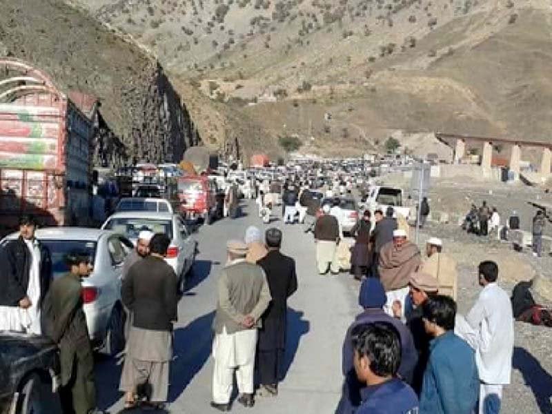 people gather on the pak afghan highway after it was closed following an intelligence alert photo express