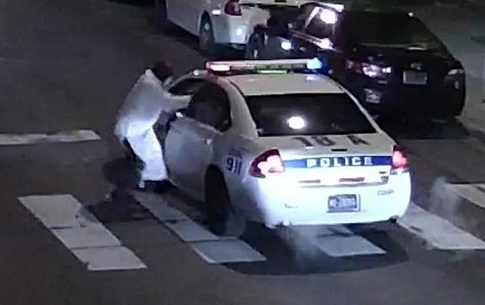 this image obtained january 8 2016 from the philadelphia police department shows a suspect shooting into a police car on january 7 2016 photo afp