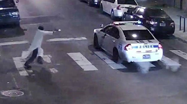 a still image from surveillance video shows a gunman l approaching a philadelphia police vehicle in which officer jesse hartnett was shot shortly before midnight in philadelphia pennsylvania this philadelphia police department image released on january 8 2016 photo reuters