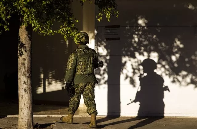 a marine stands guard on january 9 2016 in front of the house where five gang suspects were killed in the military operation which resulted in the recapture of joaquin quot el chapo quot guzman in los mochis sinaloa state mexico photo afp a marine stands guard on january 9 2016 in front of the house where five gang suspects were killed in the military operation which resulted in the recapture of joaquin quot el chapo quot guzman in los mochis sinaloa state mexico photo afp