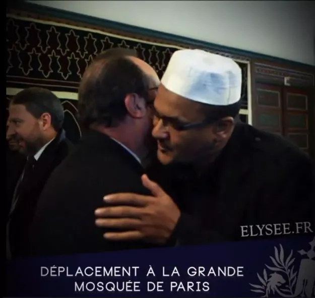 screen grab showing hollande hugging a muslim at paris main mosque screen grab showing hollande hugging a muslim at paris main mosque