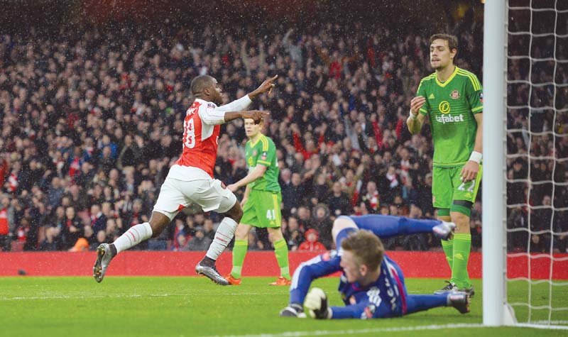 goals from campbell ramsey and giroud were enough to see the gunners through after sunderland had taken a surprise lead through lens photo afp