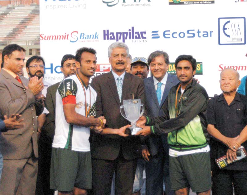 pia captain irfan left and vice captain rasool pose with the trophy after defeating wapda to bag their 29th national hockey championship title photo irfan ali express