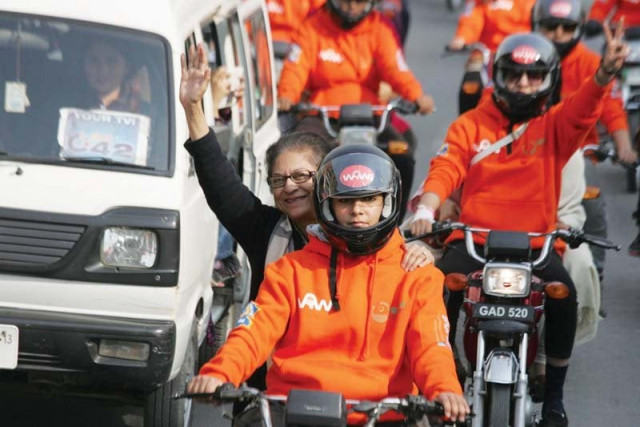 advocate asma jahangir rides pillion l two participants get set for the rally r photo shafiq malik express advocate asma jahangir rides pillion l two participants get set for the rally r photo shafiq malik express