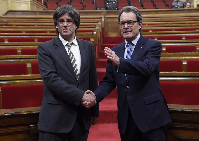new elected president of the catalan government carles puigdemont l is congratulated by former president artur mas at the end of an investiture debate for the catalan government 039 s presidency at the parliament of catalonia in barcelona on january 10 2016 the majority secessionist lawmakers in catalonia 039 s parliament voted in a new leader today tasking him to oversee the wealthy region 039 s breakaway from spain in a last minute show of unity after months of bitter infighting carles puigdemont was elected regional president with 70 votes for 63 against and two abstentions giving catalonia 039 s high profile independence movement a fresh lease of life photo afp new elected president of the catalan government carles puigdemont l is congratulated by former president artur mas at the end of an investiture debate for the catalan government 039 s presidency at the parliament of catalonia in barcelona on january 10 2016 the majority secessionist lawmakers in catalonia 039 s parliament voted in a new leader today tasking him to oversee the wealthy region 039 s breakaway from spain in a last minute show of unity after months of bitter infighting carles puigdemont was elected regional president with 70 votes for 63 against and two abstentions giving catalonia 039 s high profile independence movement a fresh lease of life photo afp