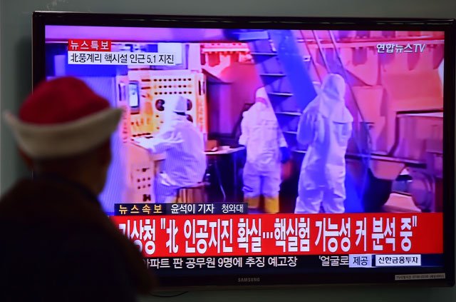 a man watches a news report at a railroad station in seoul on january 6 2016 after seismologists detected a 5 1 magnitude tremor next to north korea 039 s main atomic test site in the northeast of the country photo afp