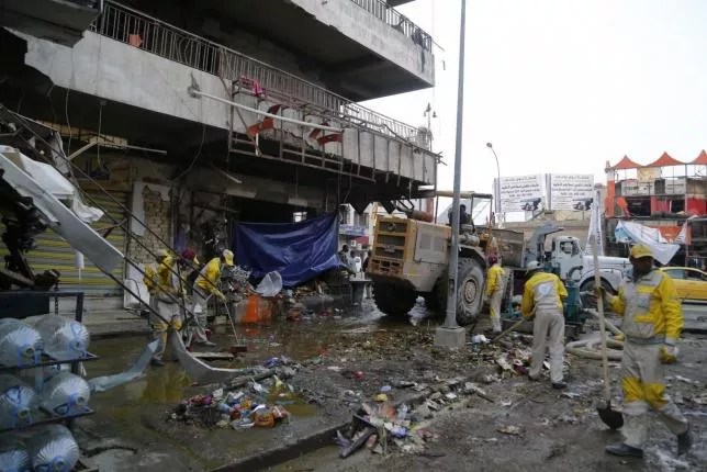 file photo of municipal workers cleaning up the site of a car bomb attack in baghdad photo file file photo of municipal workers cleaning up the site of a car bomb attack in baghdad photo file