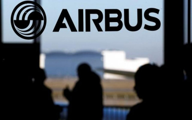 people are silhouetted past a logo of the airbus group during the airbus annual news conference in colomiers near toulouse january 13 2015 photo reuters people are silhouetted past a logo of the airbus group during the airbus annual news conference in colomiers near toulouse january 13 2015 photo reuters