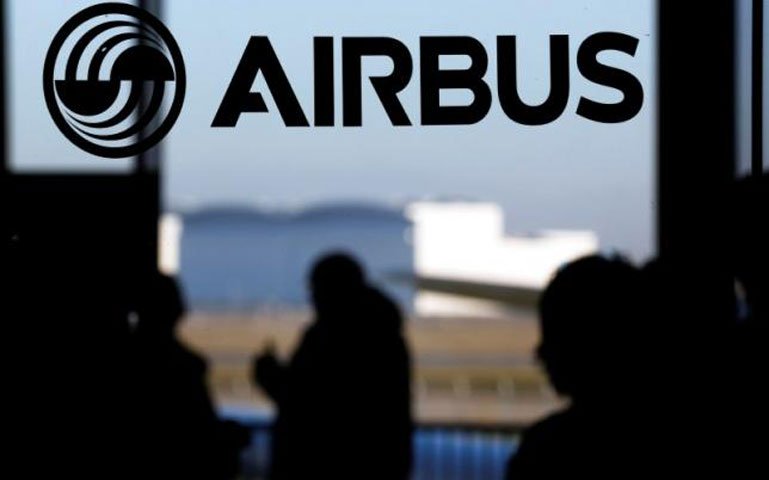 people are silhouetted past a logo of the airbus group during the airbus annual news conference in colomiers near toulouse january 13 2015 photo reuters