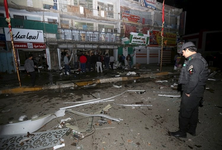 iraqi security forces gather at the site of a car bomb in new baghdad on january 11 2016 photo reuters