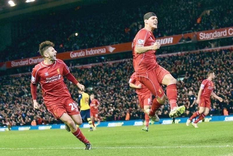 arsenal were denied a win on their last premier league trip to anfield by a 96th minute equaliser by a bandaged martin skrtel photo afp