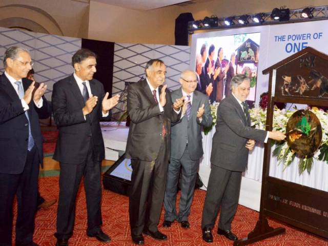 finance minister ishaq dar rings the bell of pakistan stock exchange photo express