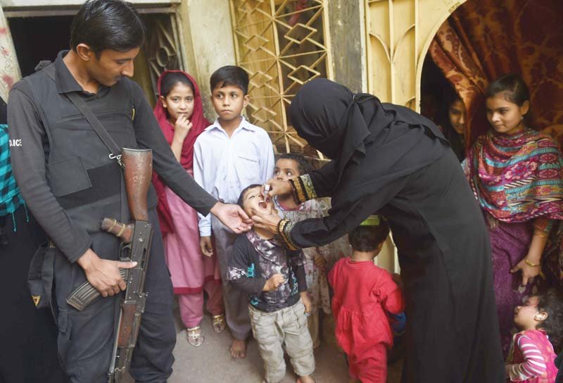 a health worker administers polio drops to a child during a vaccination campaign in karachi on tuesday pakistan is one of only two countries in the world where polio remains endemic photo afp