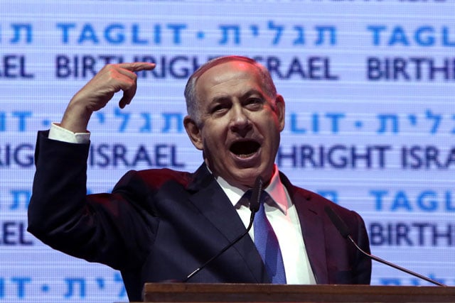 israeli prime minister benjamin netanyahu gestures as he speaks during the taglit birthright annual event in jerusalem on january 12 2016 photo afp